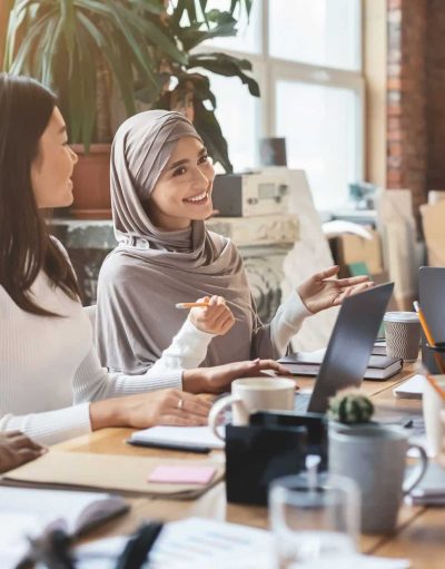 Young multiracial people having business meeting in office